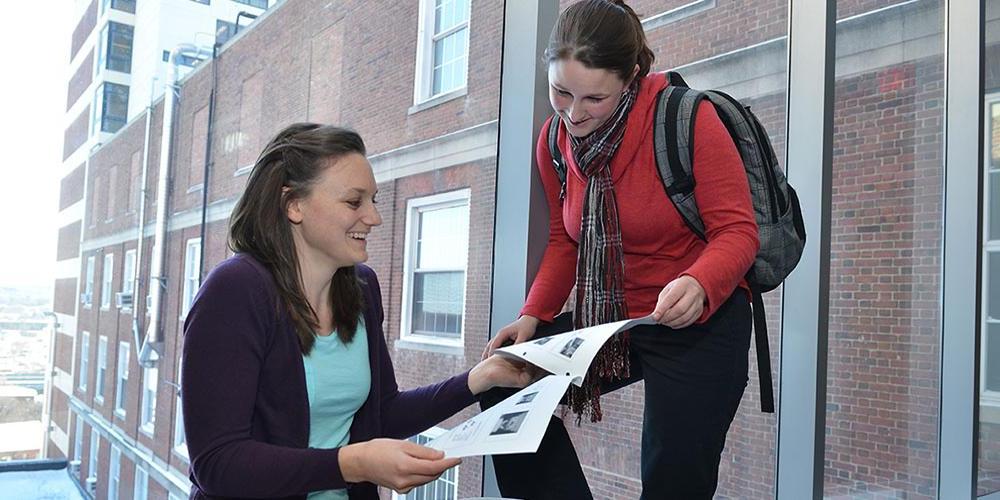 Two students comparing notes