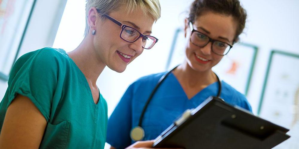 Nurses reviewing a chart